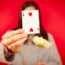 free-photo-of-woman-holding-a-two-of-hearts-card
