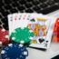 Poker chips and cards on computer keyboard